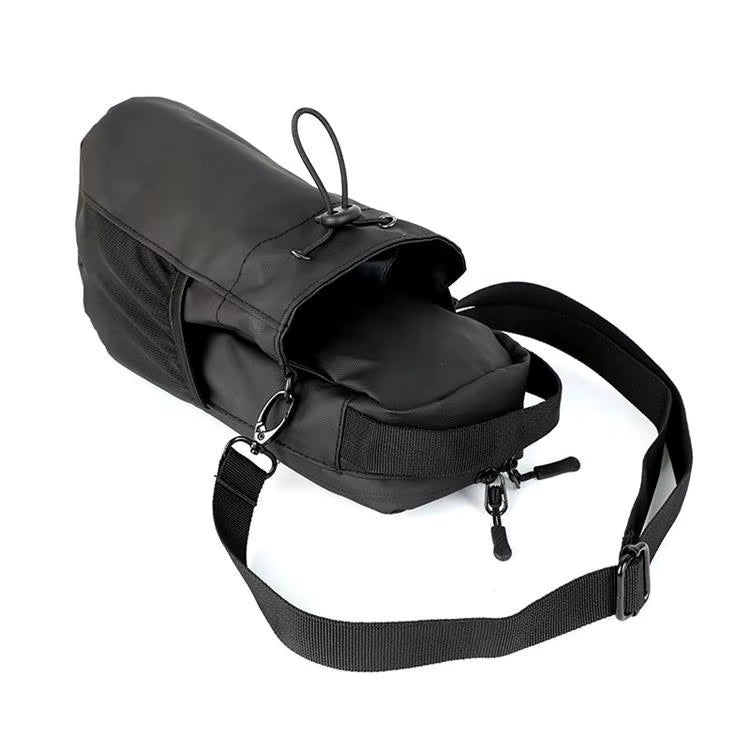 Black saddle bag with a strap on a white background